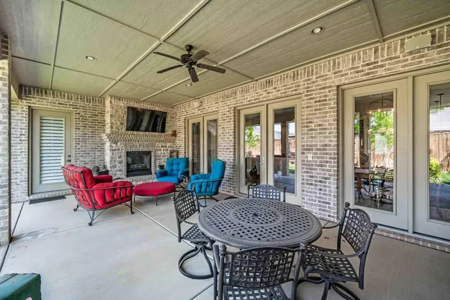 a outdoor space with patio furniture and a fireplace