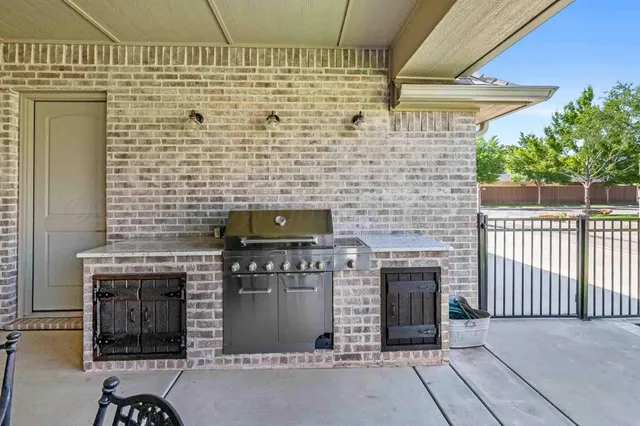 a stove top oven sitting inside of a house