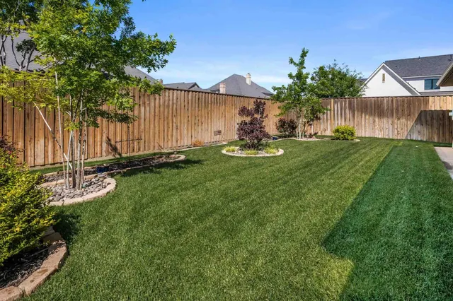 a view of a backyard with a garden