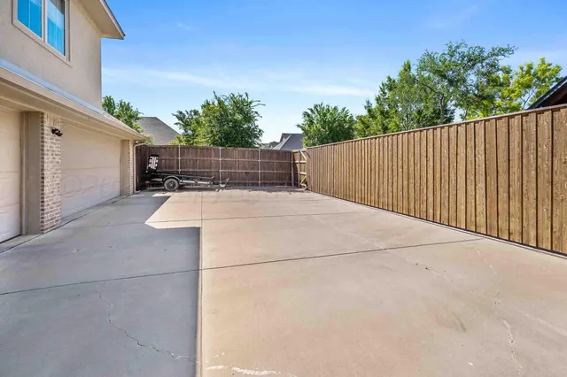 a view of balcony with wooden fence