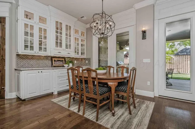 a view of a dining room with furniture and window