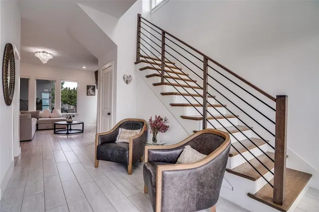 a large kitchen with a table and chairs