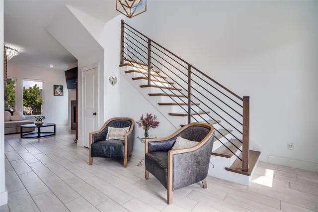 a view of an entryway with wooden floor