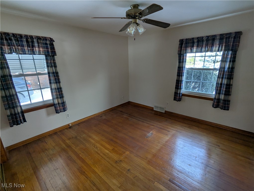 815 East Schaaf Road Independence, OH 44131 - Photo 13 of 36 Unfurnished room with ceiling fan and wood-type flooring