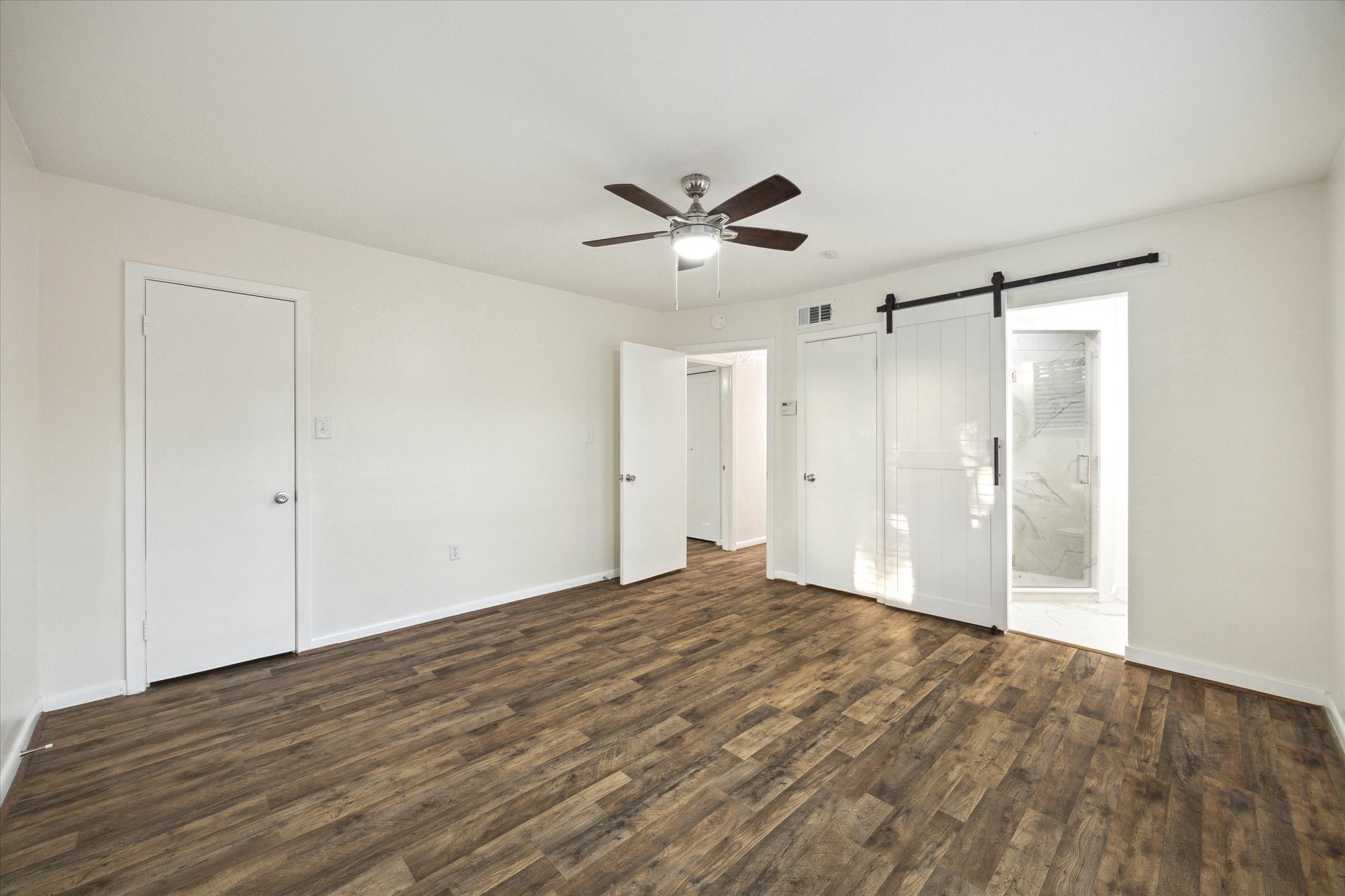 1309 Centennial Drive Houston, TX 77055 - Photo 15 of 33 a view of empty room with wooden floor
