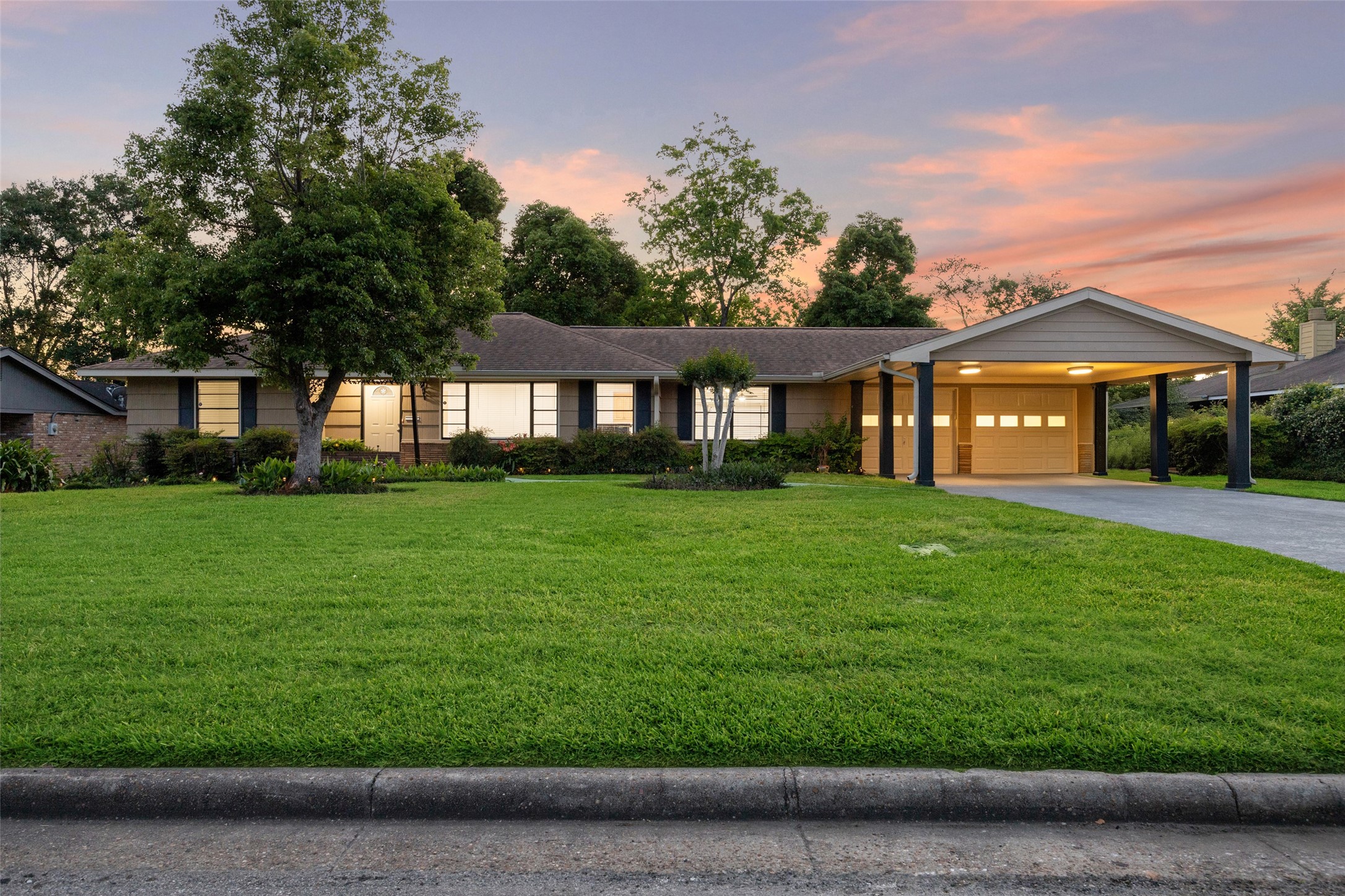 1309 Centennial Drive Houston, TX 77055 - Photo 2 of 33 a front view of a house with a yard