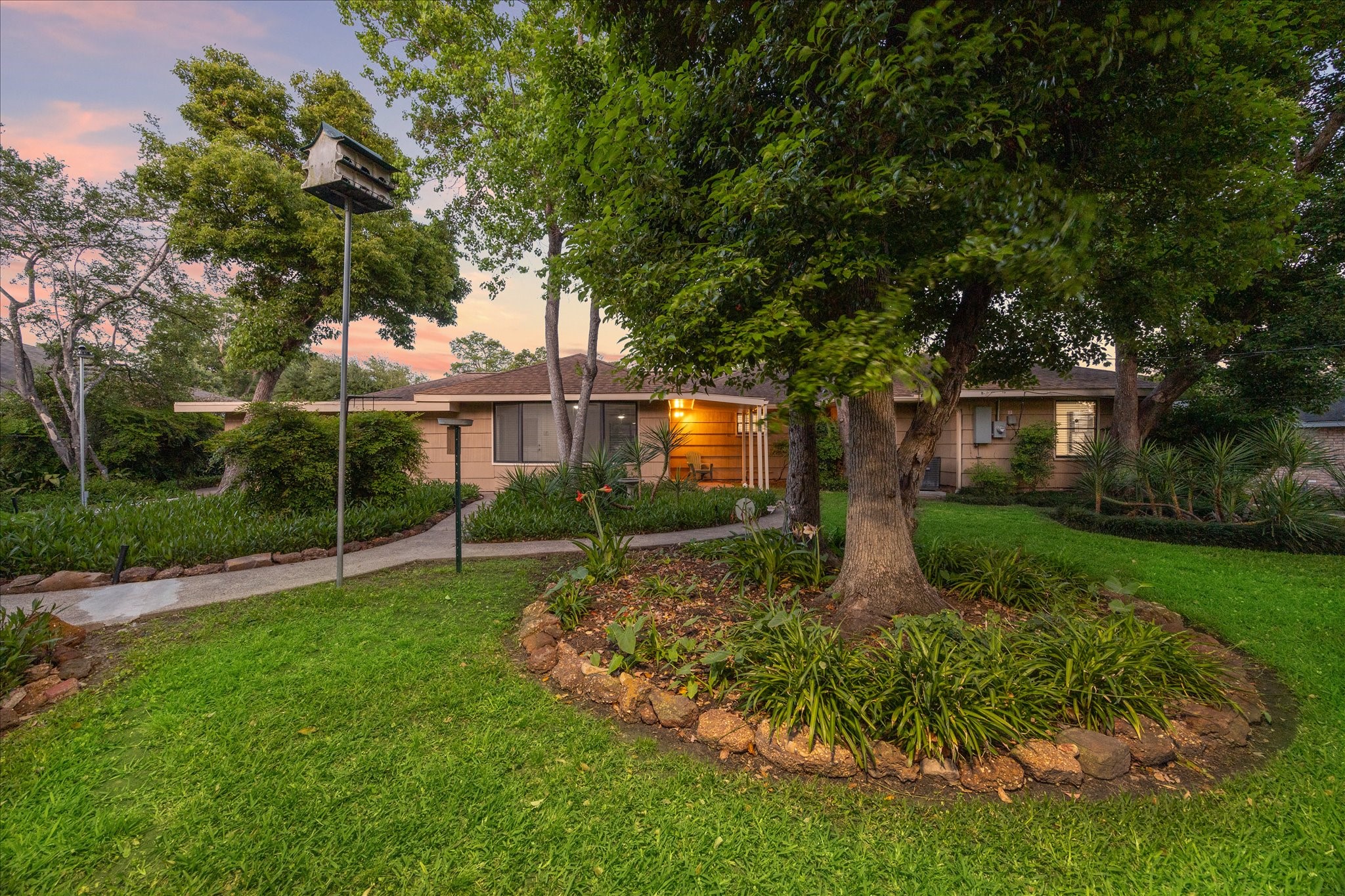 1309 Centennial Drive Houston, TX 77055 - Photo 28 of 33 a view of backyard with plants and large trees