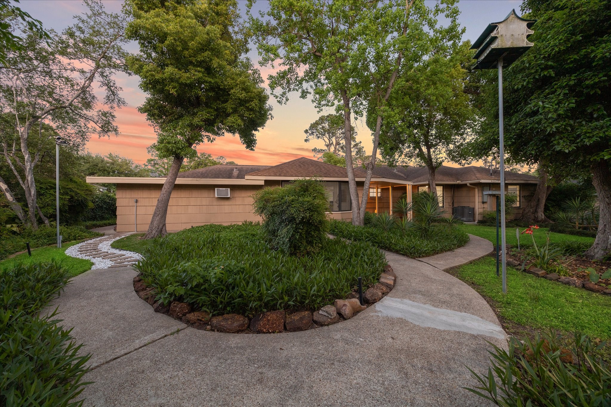 1309 Centennial Drive Houston, TX 77055 - Photo 29 of 33 front view of a house with a garden
