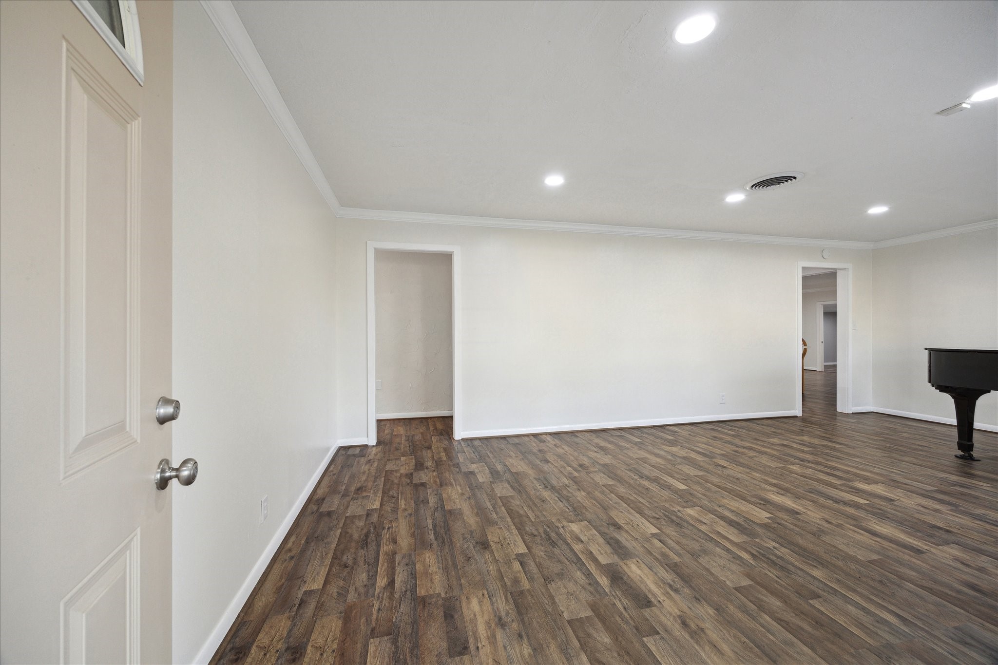 1309 Centennial Drive Houston, TX 77055 - Photo 5 of 33 a view of an empty room with wooden floor