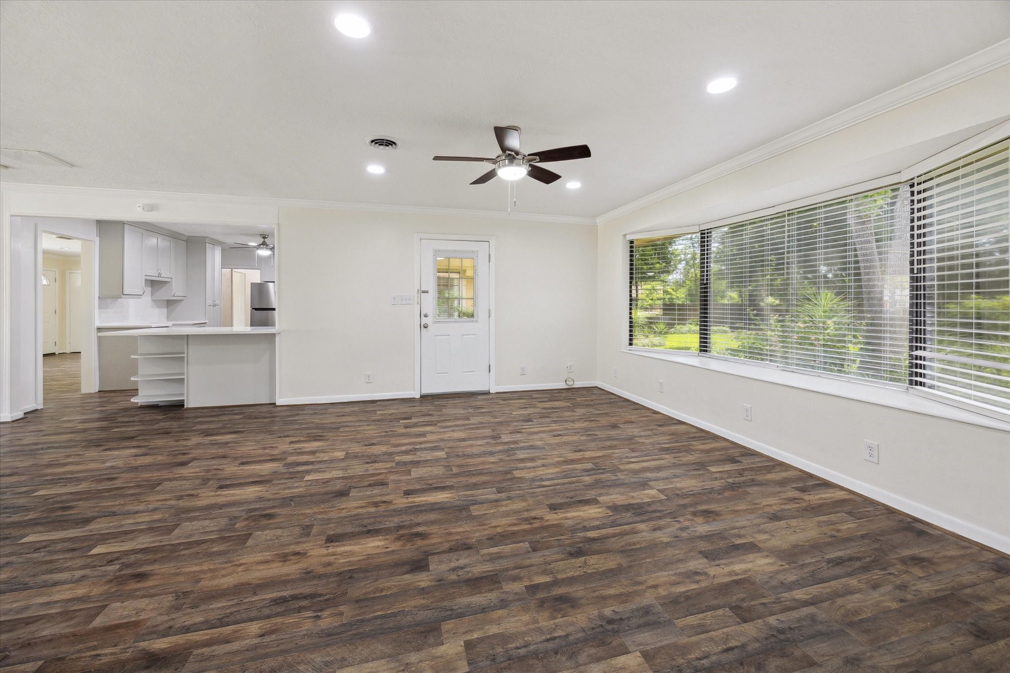 1309 Centennial Drive Houston, TX 77055 - Photo 8 of 33 a view of empty room with wooden floor and fan
