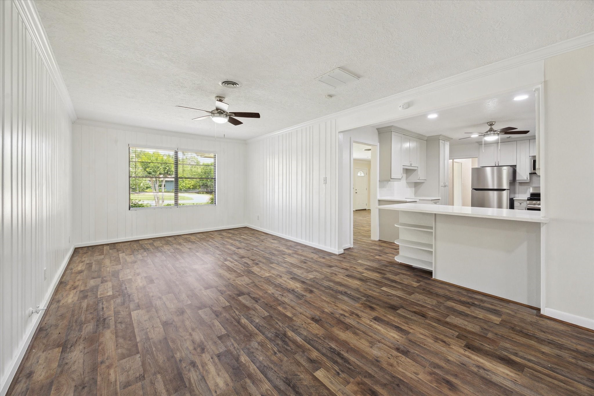 1309 Centennial Drive Houston, TX 77055 - Photo 9 of 33 a view of kitchen with wooden floor and windows