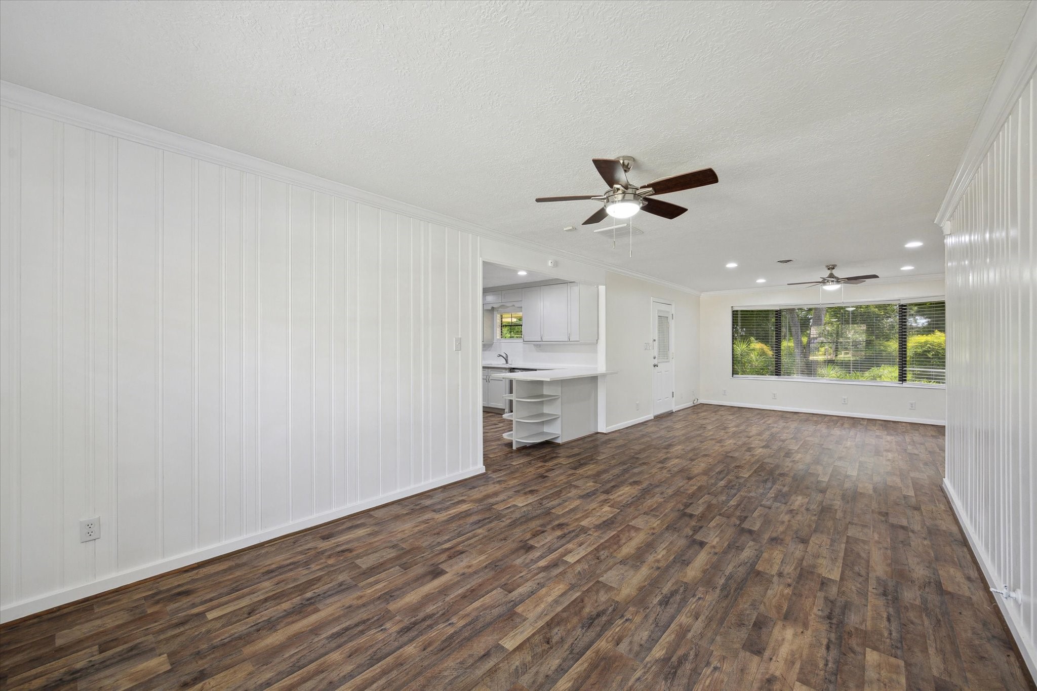 1309 Centennial Drive Houston, TX 77055 - Photo 10 of 33 wooden floor in an empty room with a window