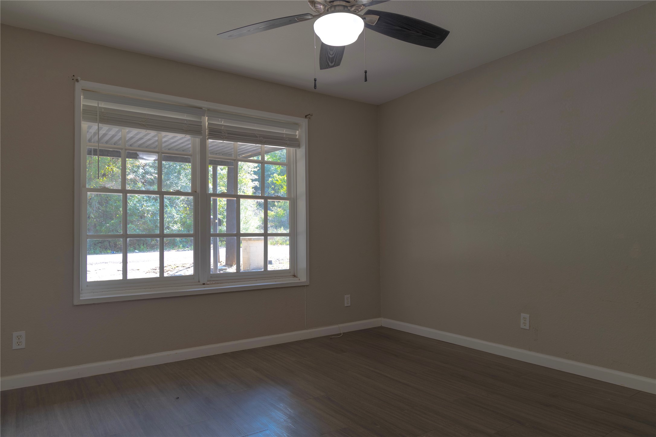120 Erskine Ferry Road Seguin, TX 78155 - Photo 8 of 26 an empty room with wooden floor and windows