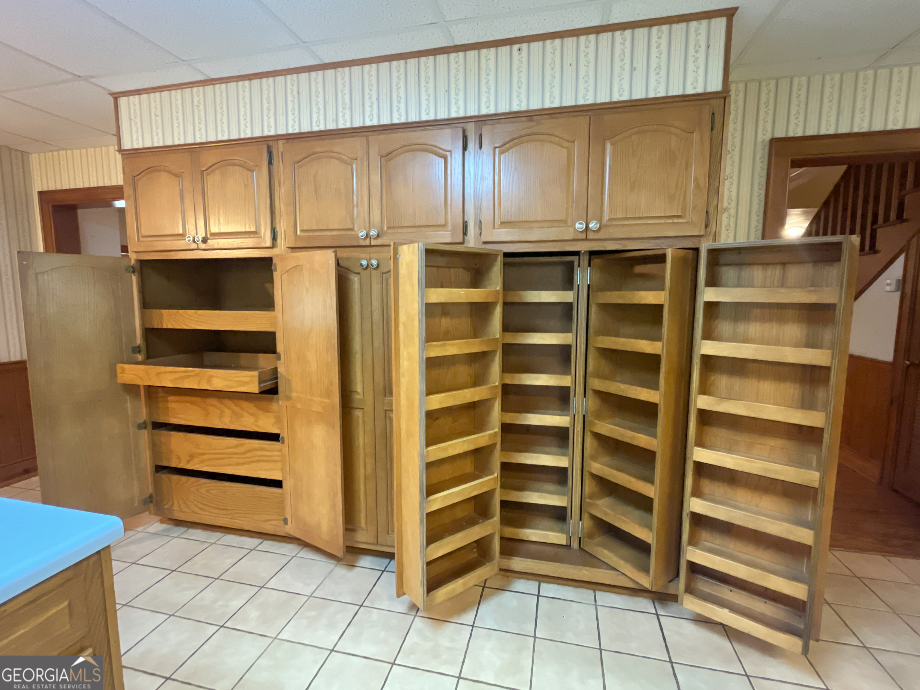 3222 Highway 80 Dublin, GA 31021 - Photo 11 of 49 a view of walk in closet with empty racks