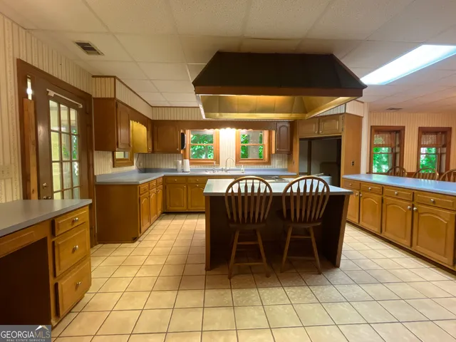 a dining area with a sink a counter top space and appliances