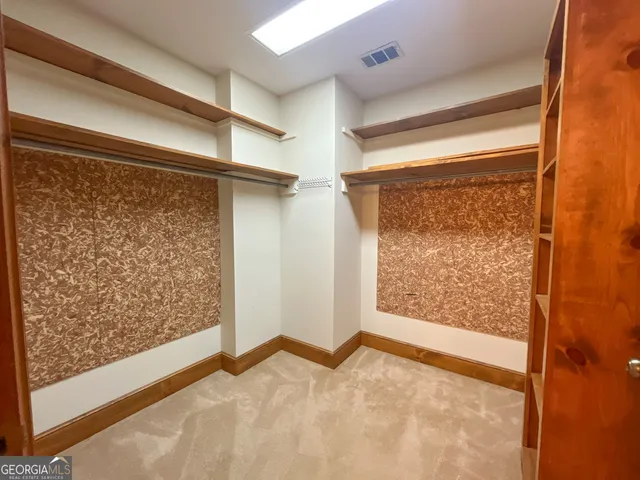 a view of room with window and gate