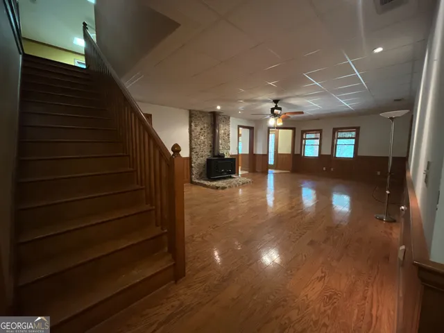 a view of entryway and hall with wooden floor
