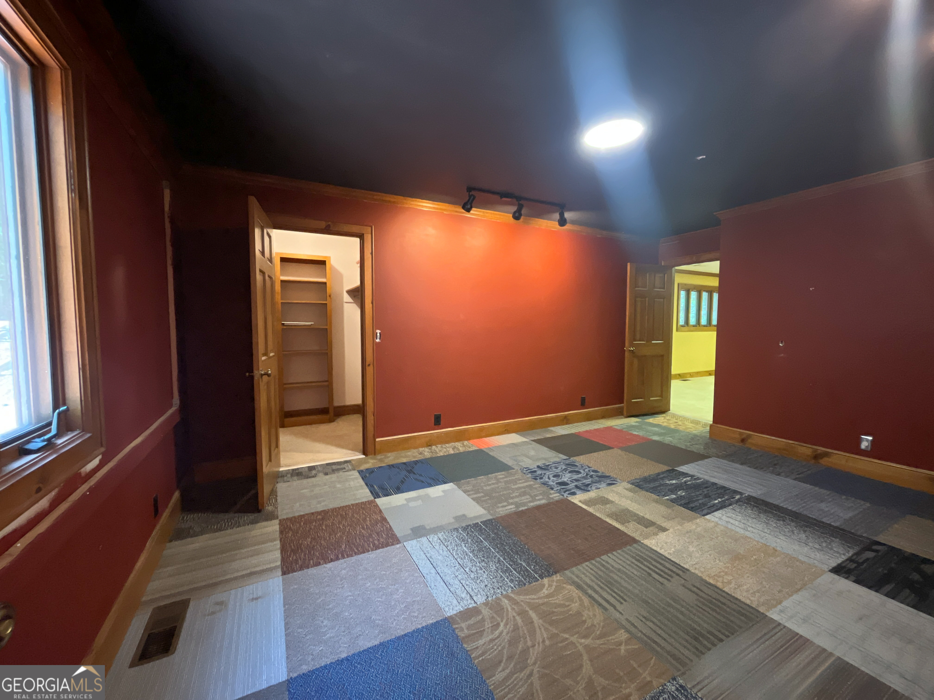 3222 Highway 80 Dublin, GA 31021 - Photo 35 of 49 a view of an empty room with window and stairs