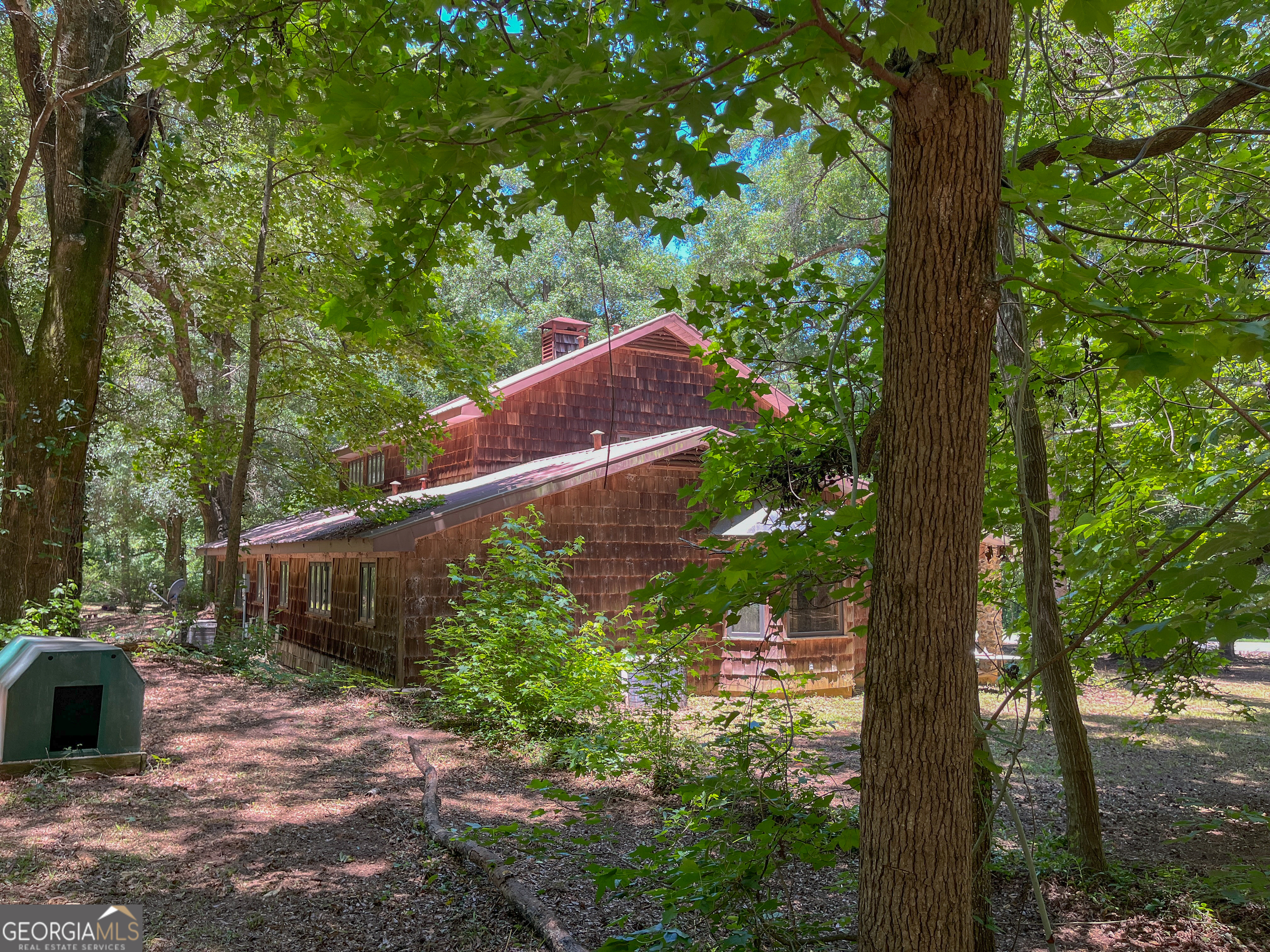 3222 Highway 80 Dublin, GA 31021 - Photo 42 of 49 a backyard of a house with lots of green space and fountain