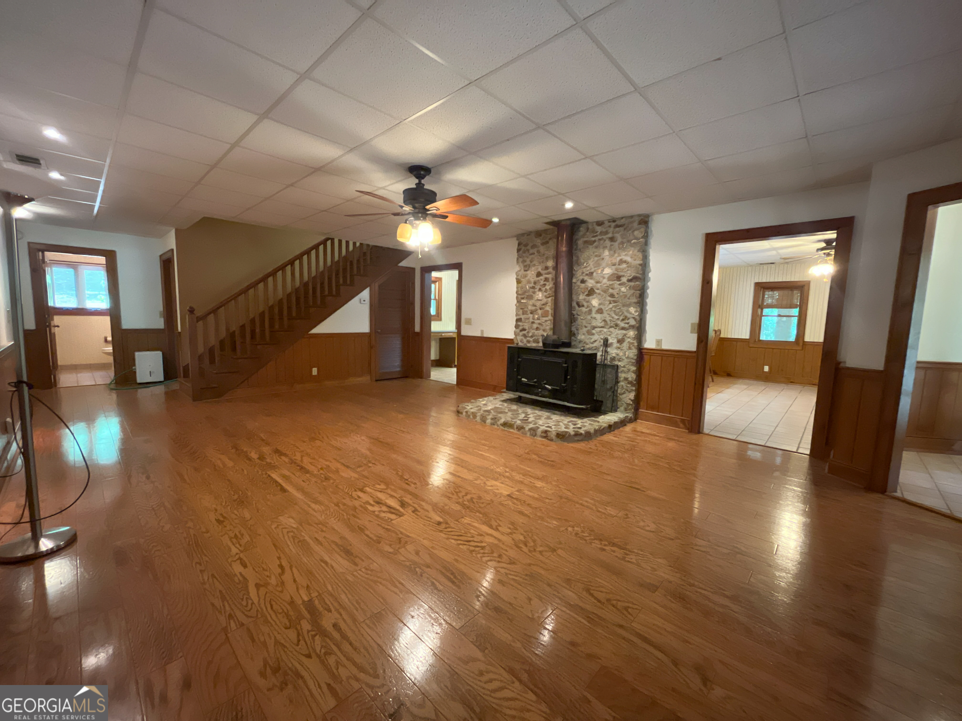 3222 Highway 80 Dublin, GA 31021 - Photo 8 of 49 an empty room with wooden floor and windows