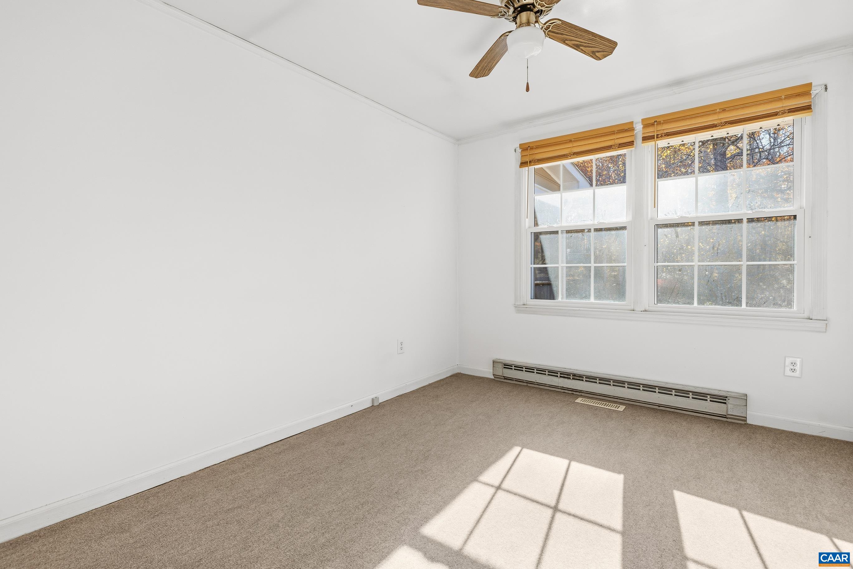 3590 Green Creek Road Schuyler, VA 22969 - Photo 12 of 25 an empty room with windows and ceiling fan