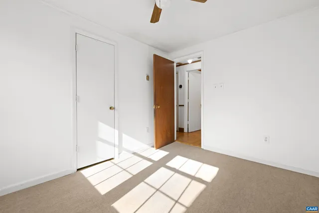 a bathroom with a sink a toilet and shower curtain