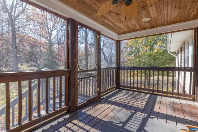 a view of backyard with large trees