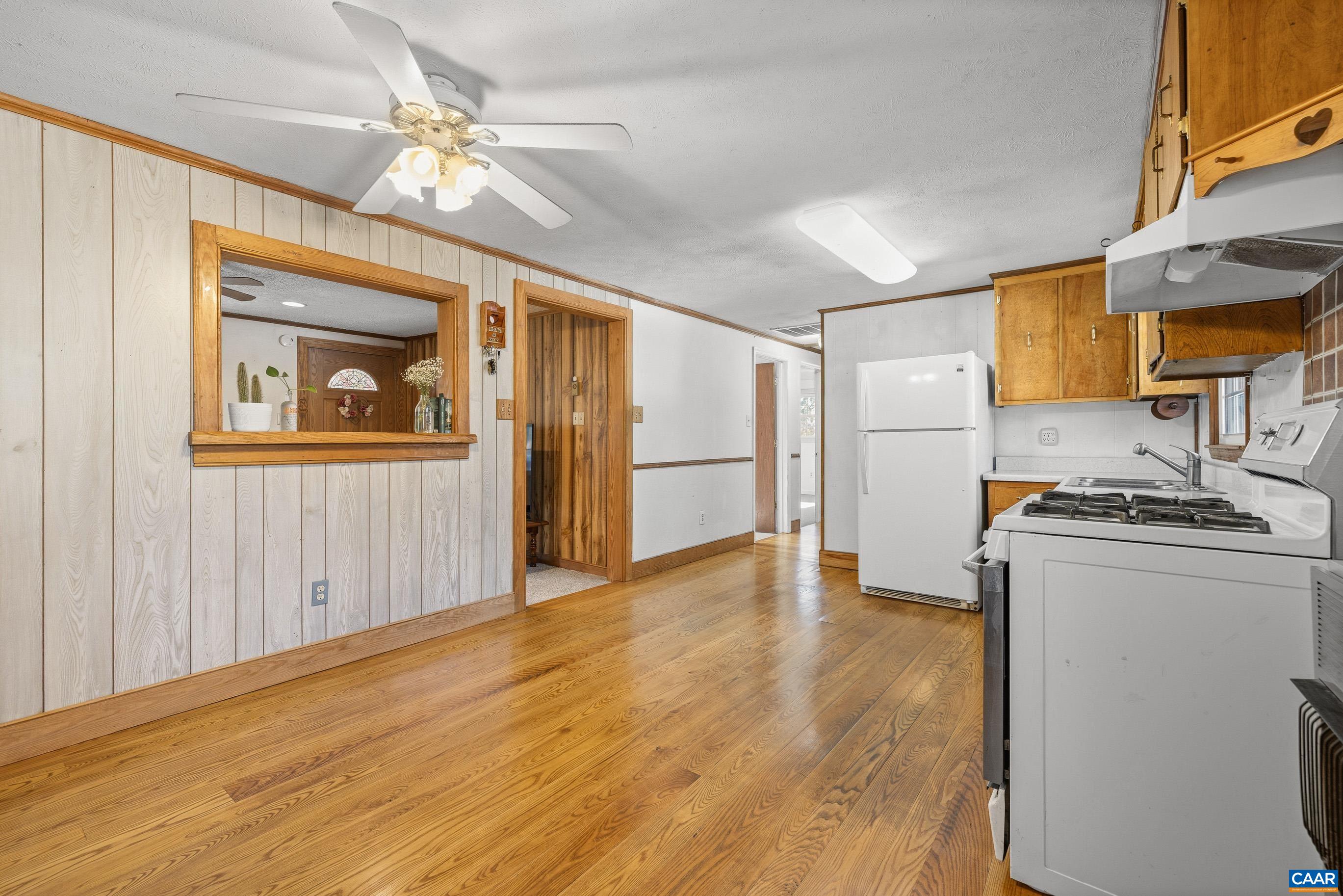 3590 Green Creek Road Schuyler, VA 22969 - Photo 8 of 25 a view of a kitchen with a stove cabinets and wooden floor