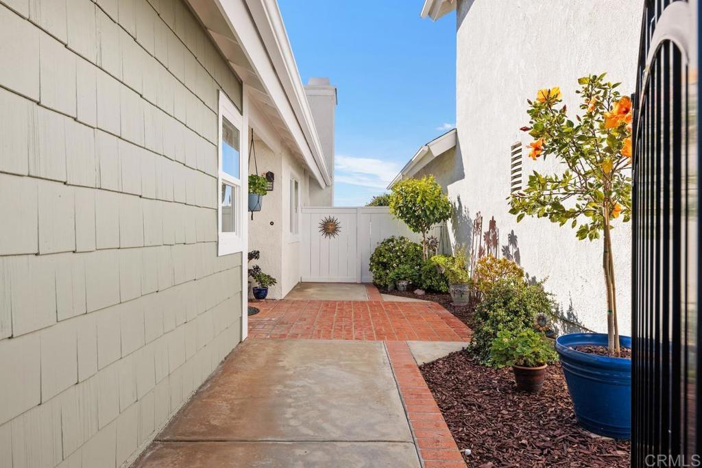 6833 Watercourse Drive Carlsbad, CA 92011 - Photo 12 of 49 a view of path along with potted plants