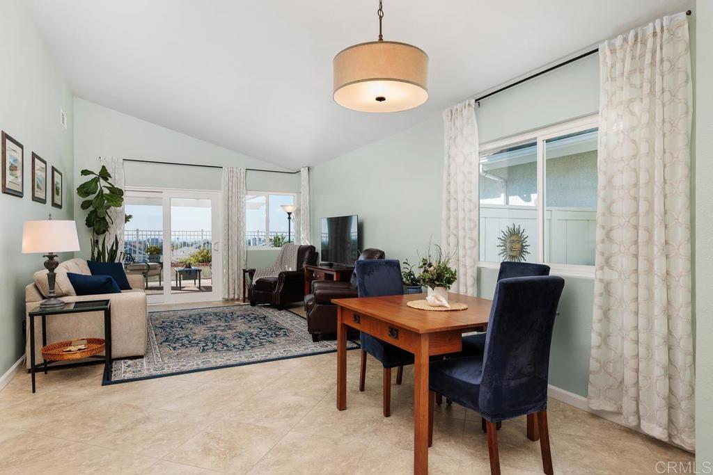 6833 Watercourse Drive Carlsbad, CA 92011 - Photo 14 of 49 a living room with furniture and a chandelier