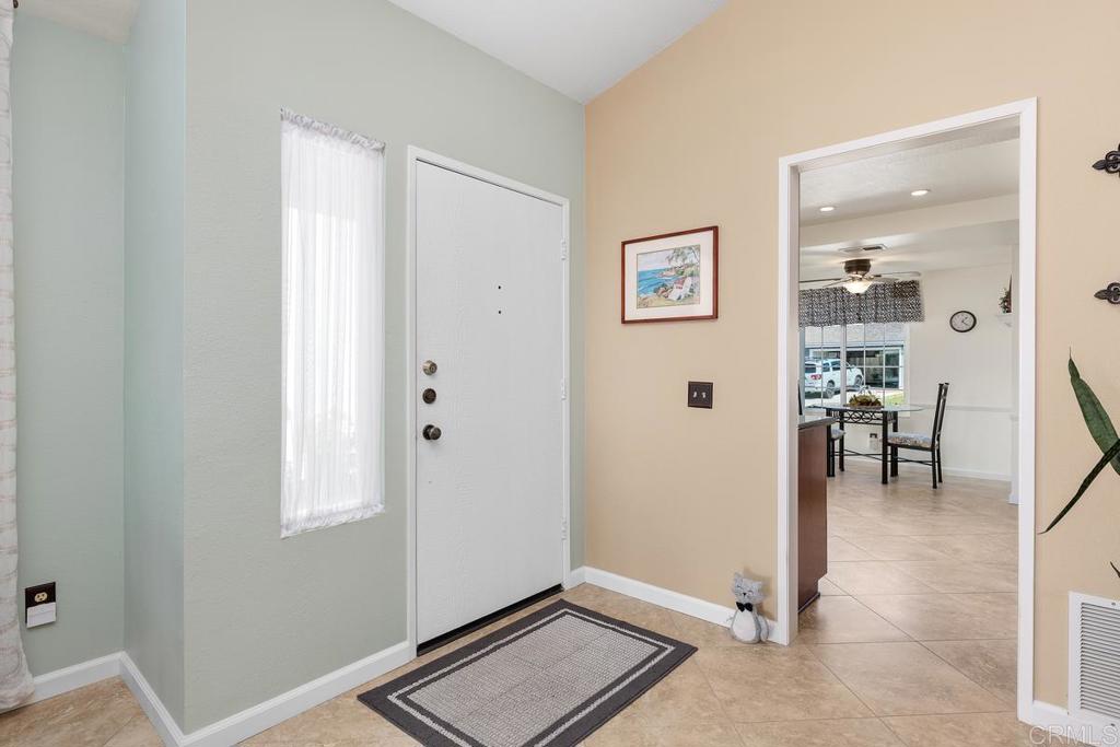 6833 Watercourse Drive Carlsbad, CA 92011 - Photo 20 of 49 a view of workspace with wooden floor and windows