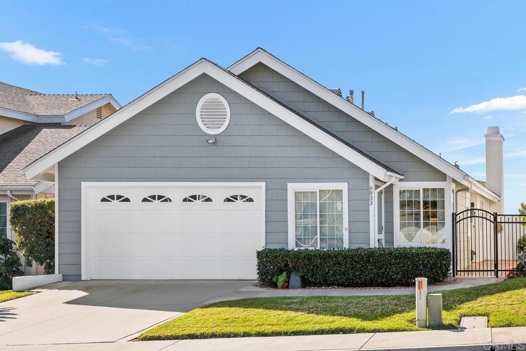 6833 Watercourse Drive Carlsbad, CA 92011 - Photo 24 of 49 a front view of a house with a yard