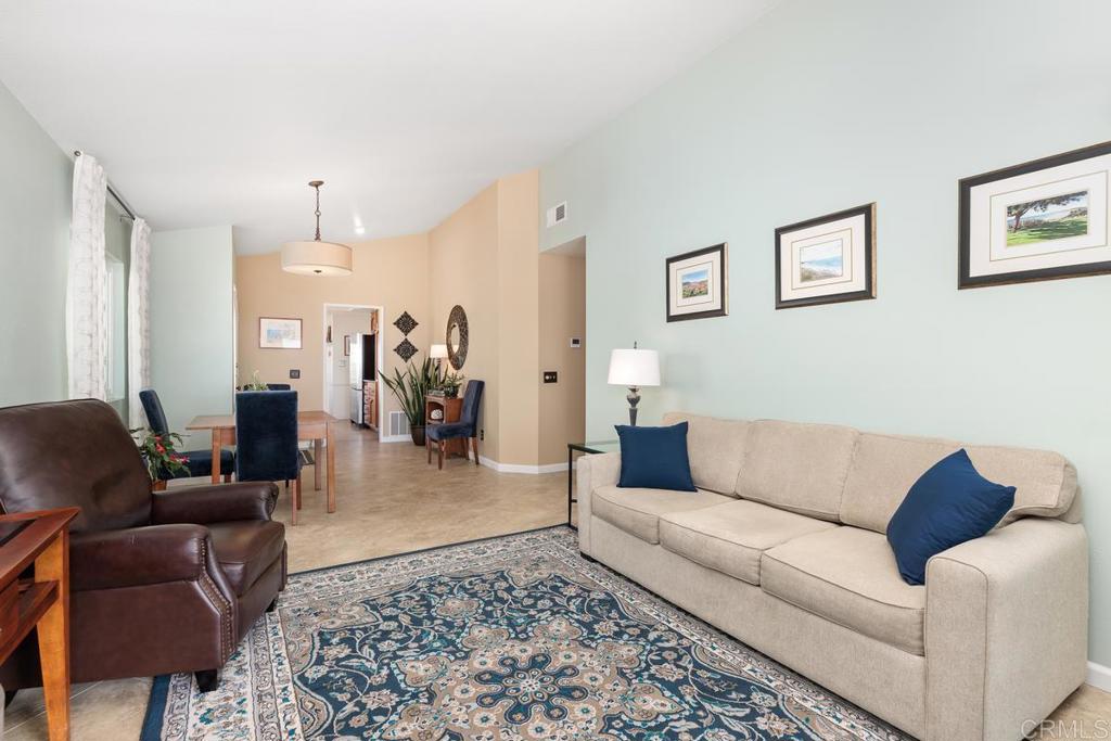 6833 Watercourse Drive Carlsbad, CA 92011 - Photo 26 of 49 a living room with furniture and a couch