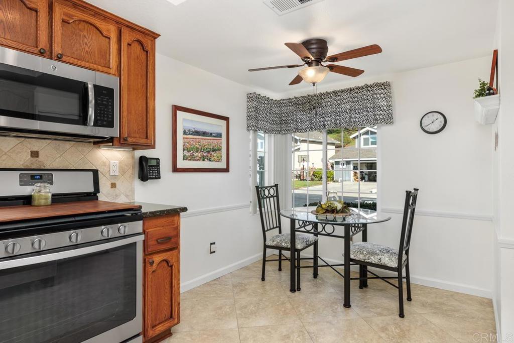 6833 Watercourse Drive Carlsbad, CA 92011 - Photo 28 of 49 a dining room with furniture and window