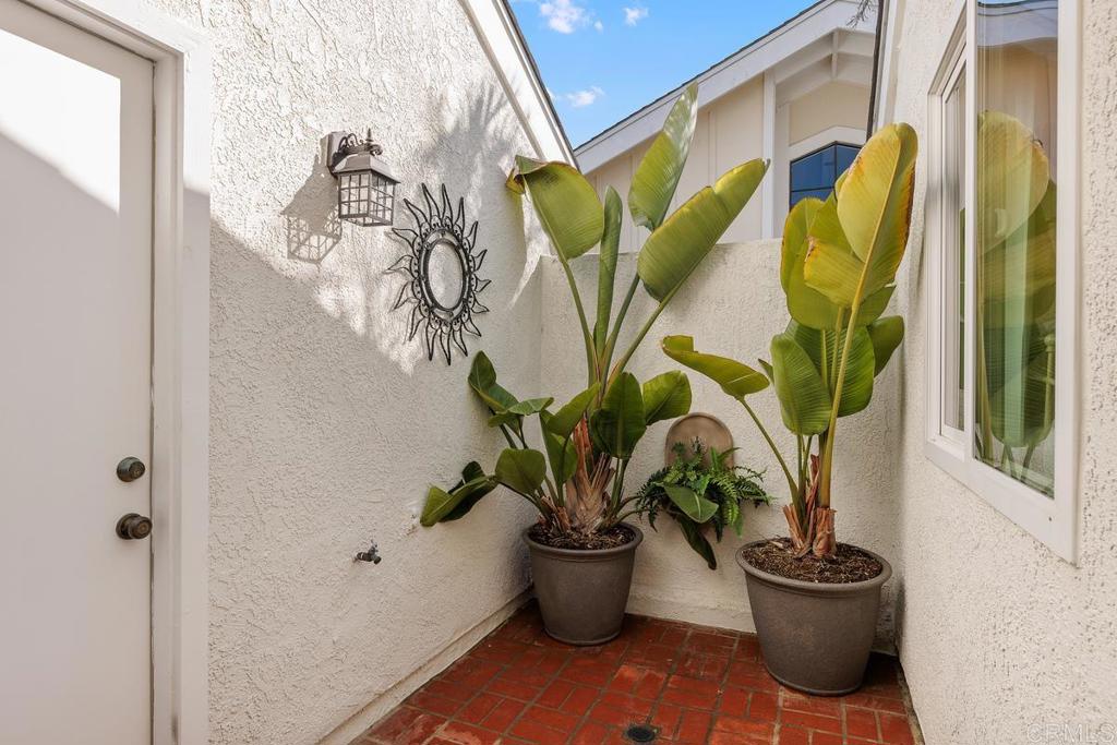 6833 Watercourse Drive Carlsbad, CA 92011 - Photo 33 of 49 a view of a vase of flowers sitting on a floor