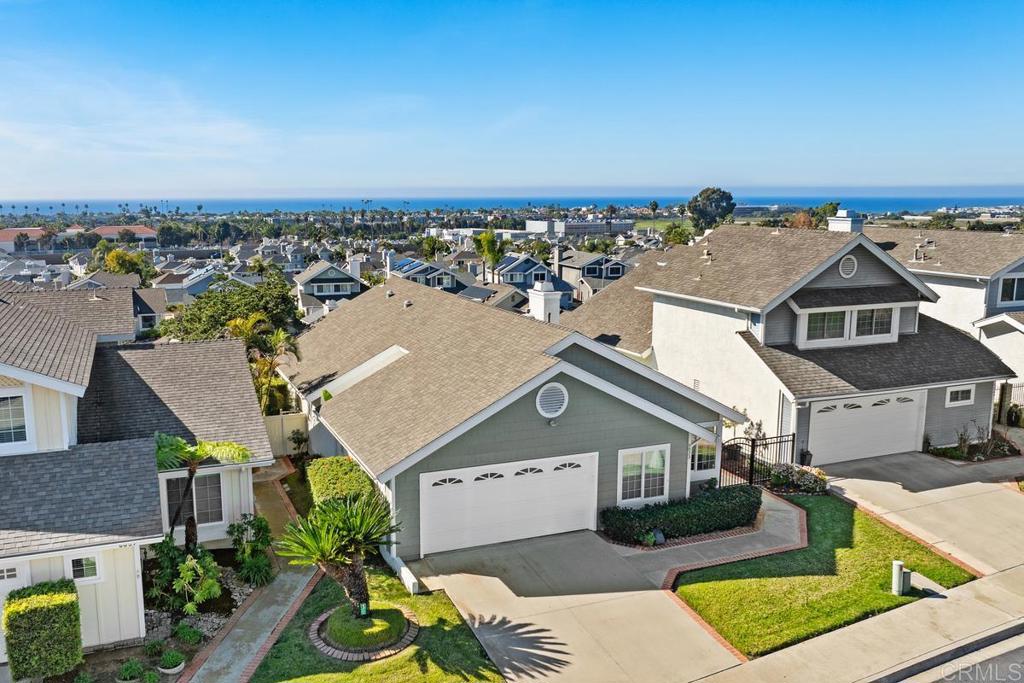 6833 Watercourse Drive Carlsbad, CA 92011 - Photo 36 of 49 an aerial view of a house with a yard