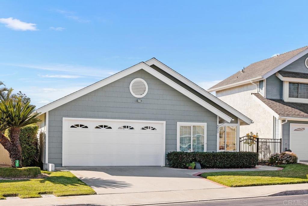 6833 Watercourse Drive Carlsbad, CA 92011 - Photo 40 of 49 a view of a house with a yard
