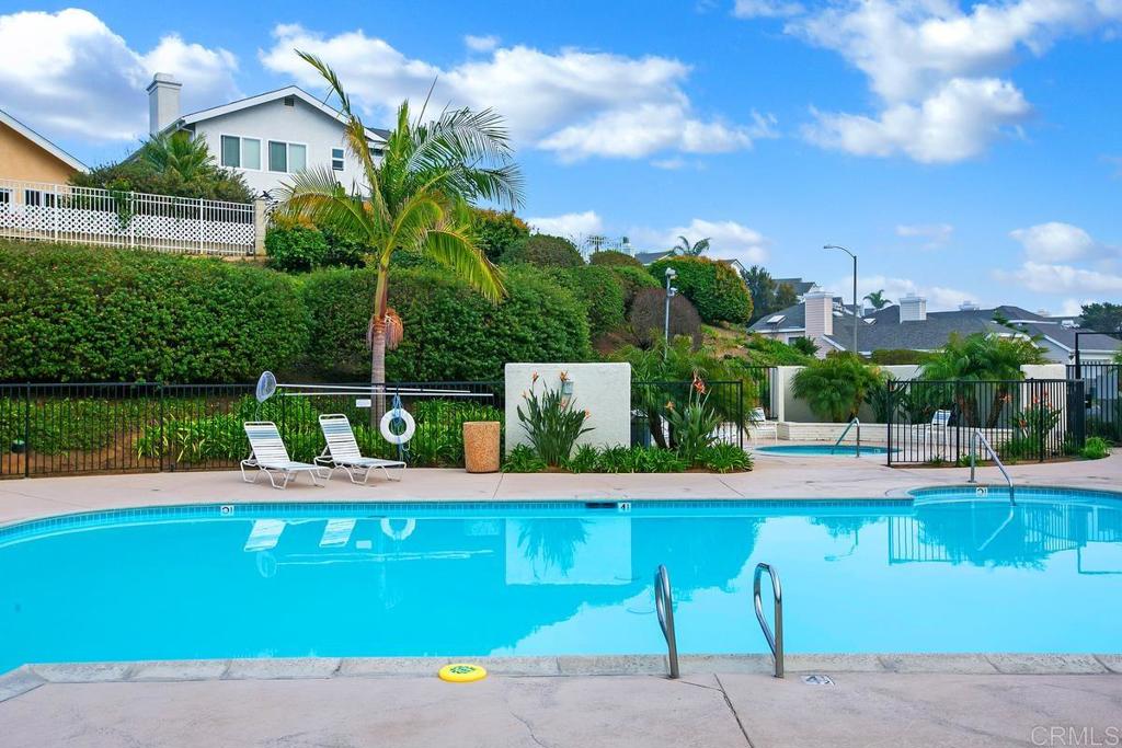 6833 Watercourse Drive Carlsbad, CA 92011 - Photo 42 of 49 a view of a house with a yard and potted plants