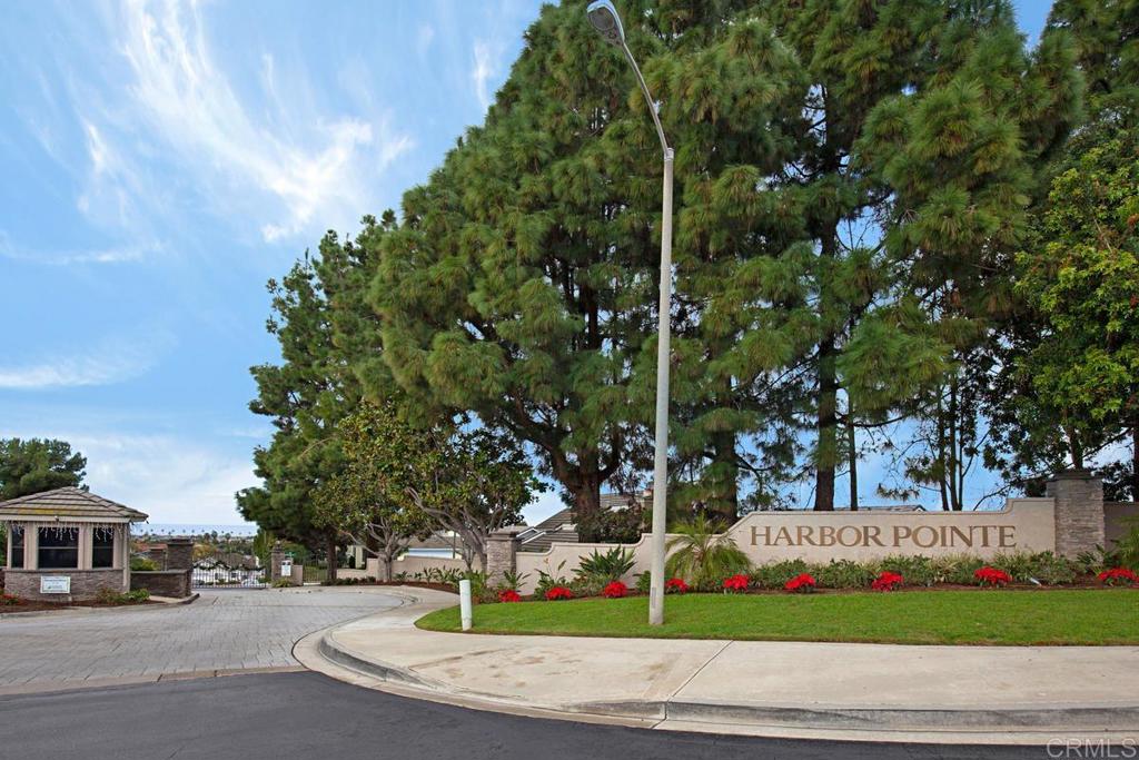 6833 Watercourse Drive Carlsbad, CA 92011 - Photo 46 of 49 a front view of a house with a yard