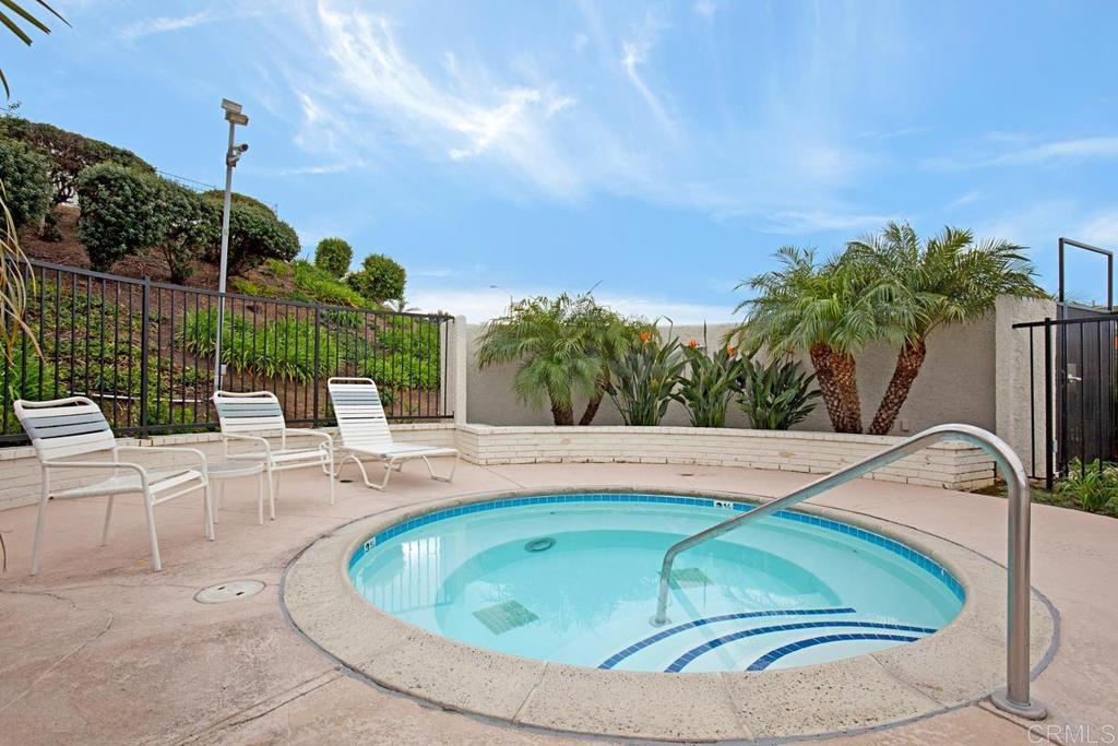 6833 Watercourse Drive Carlsbad, CA 92011 - Photo 49 of 49 a view of a swimming pool with a patio and plants