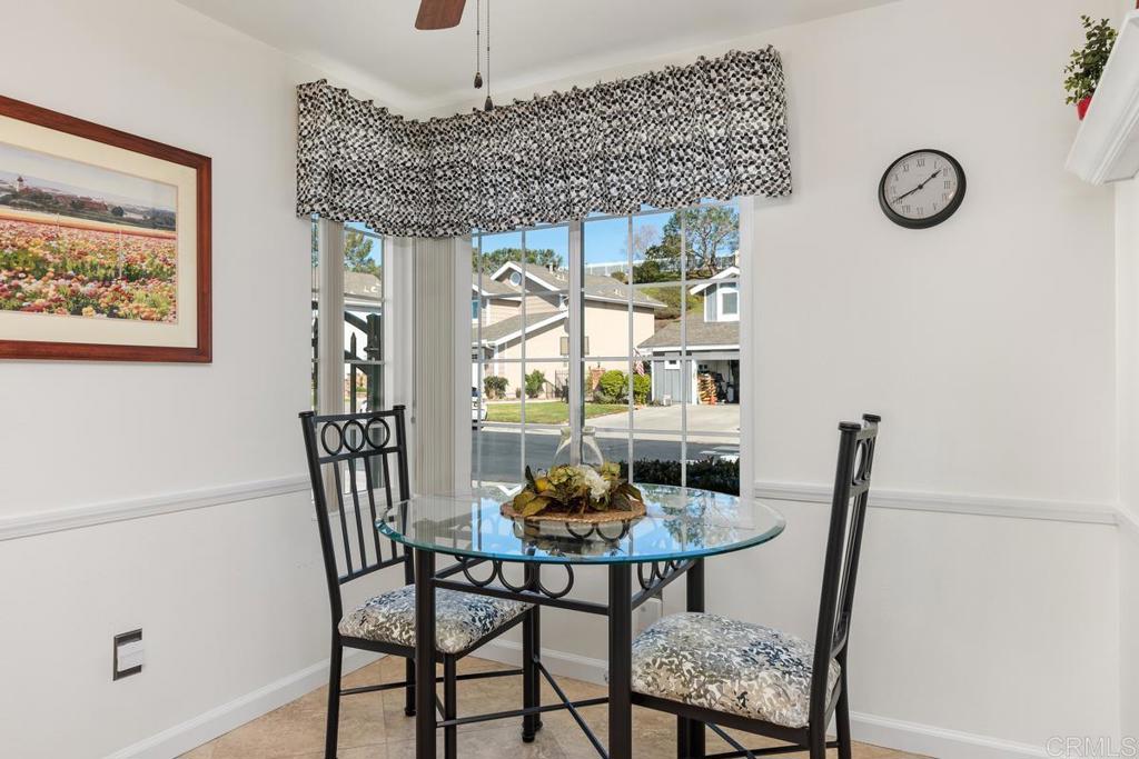 6833 Watercourse Drive Carlsbad, CA 92011 - Photo 8 of 49 a dining room with furniture and window