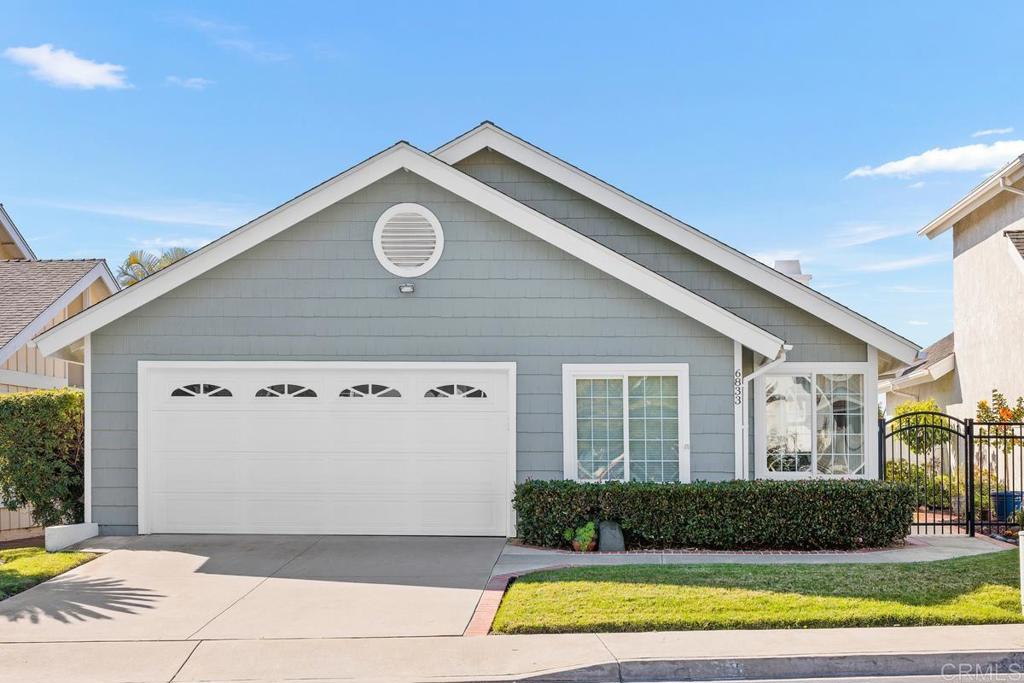 6833 Watercourse Drive Carlsbad, CA 92011 - Photo 10 of 49 a front view of a house with a yard