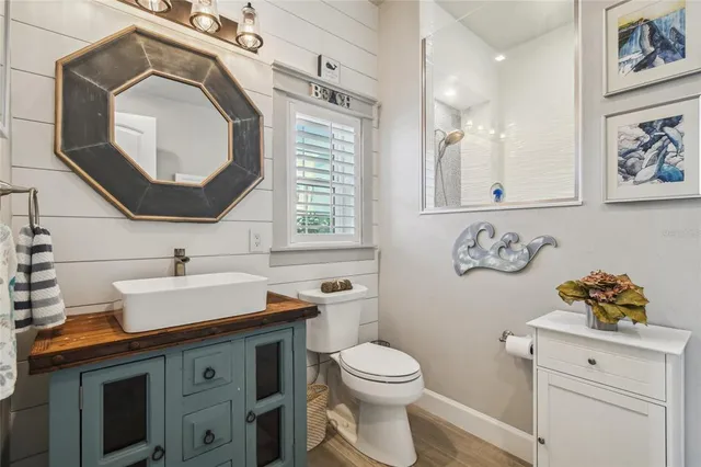 a bathroom with a sink a washer and dryer