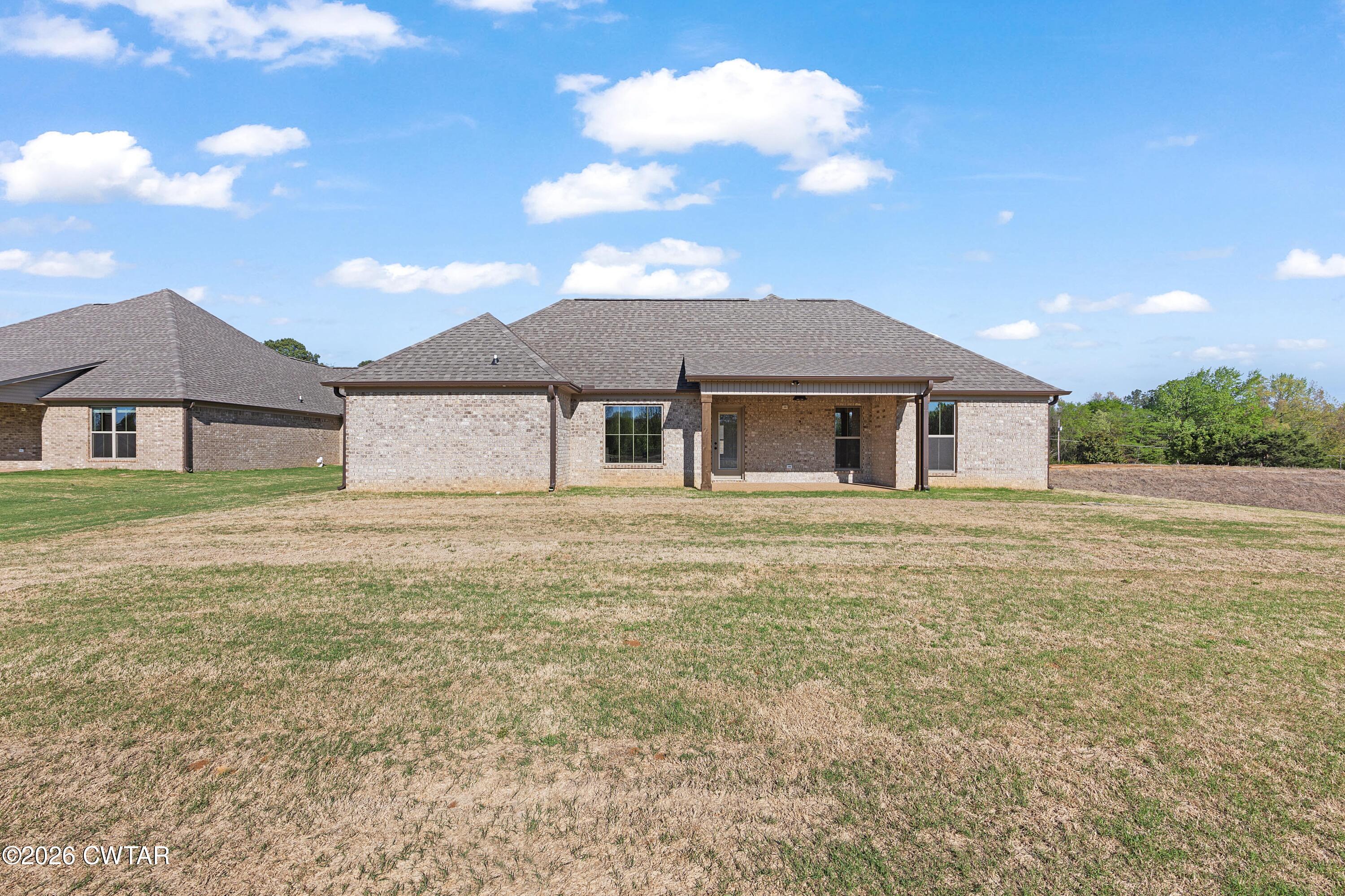 19 Emerald Downs Three Way, TN 38343 - Photo 2 of 17 a house with yard in front of it