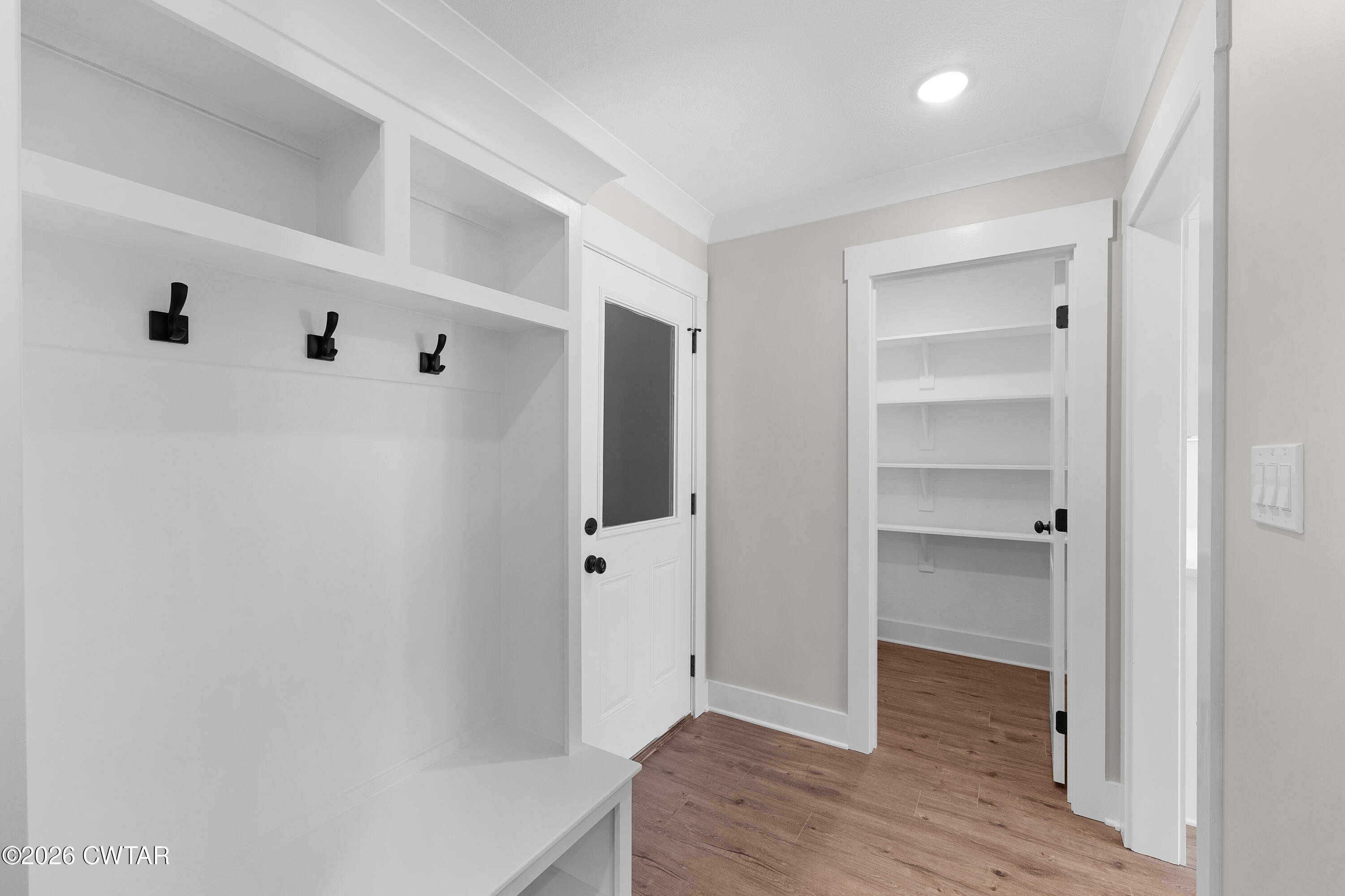 19 Emerald Downs Three Way, TN 38343 - Photo 9 of 17 a view of walk in closet with wooden floor