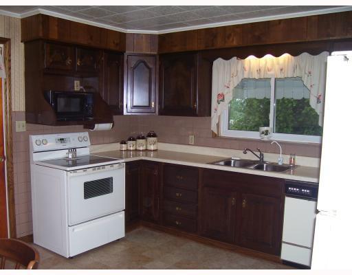 327 Service Creek Road Aliquippa, PA 15001 - Photo 5 of 8 Kitchen. This 14 x 12 eat in kitchen features lovely cabinetry, electric stove, dishwasher and refrigerator.