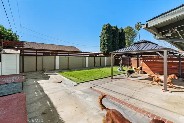 a view of a building with a backyard