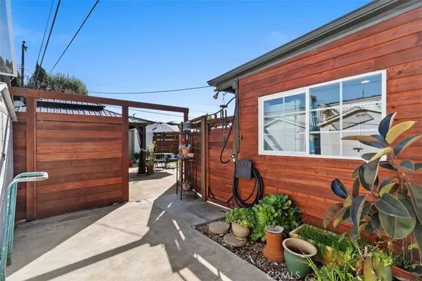 a front view of a house with outdoor seating