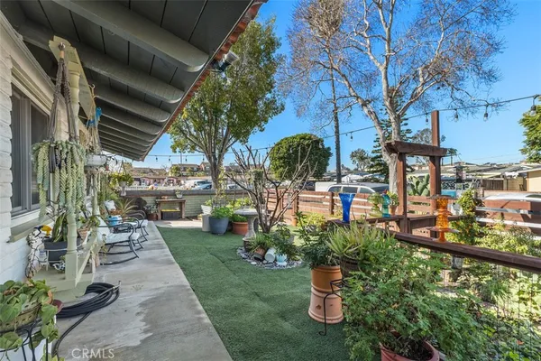 a view of a backyard with sitting area