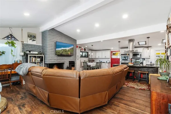 a living room with furniture a fireplace and a fireplace